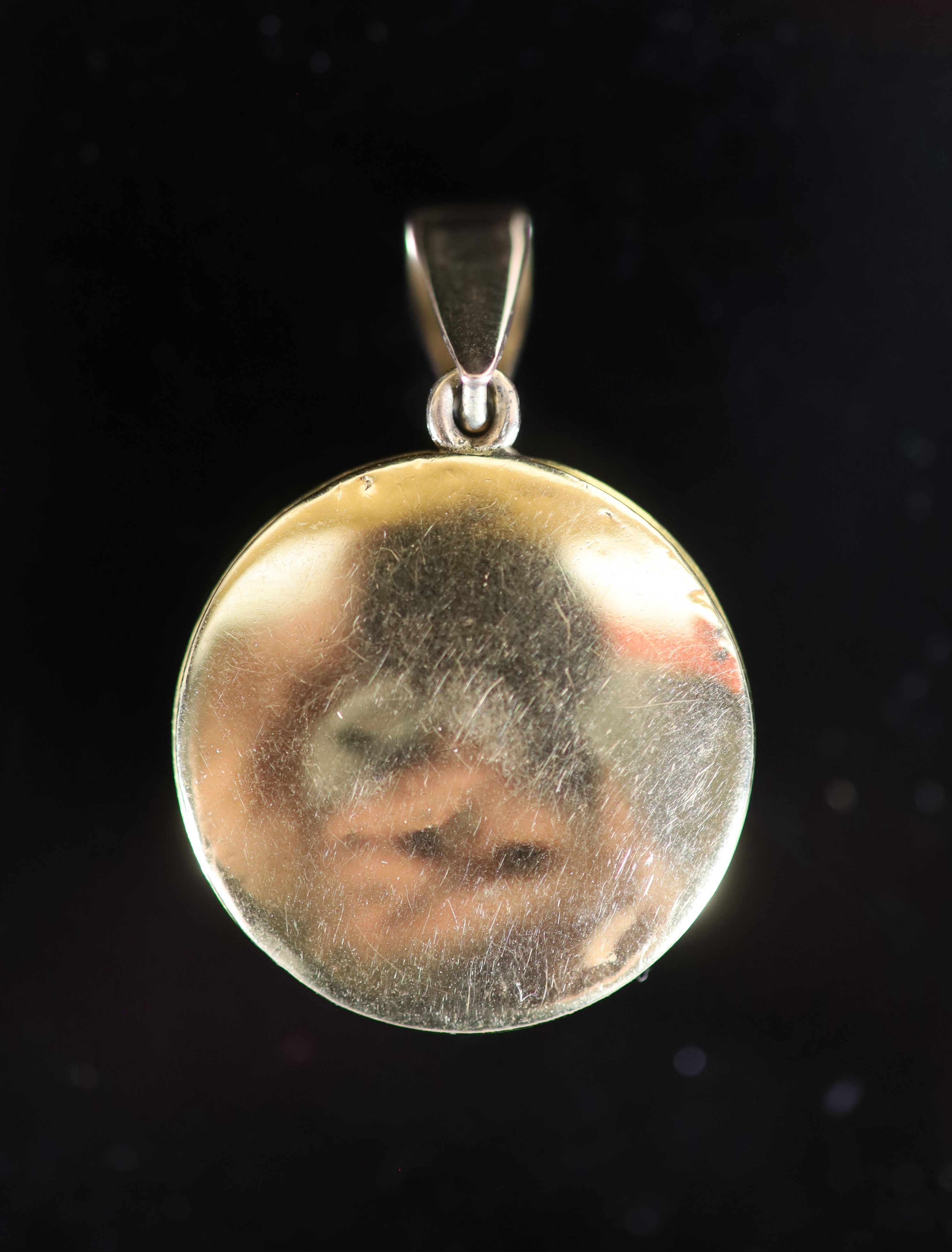 A Victorian gold mounted Essex crystal circular pendant, decorated with a terrier dog